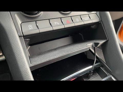 Přihrádka s bezdrátovým nabíjením pod palubní desku